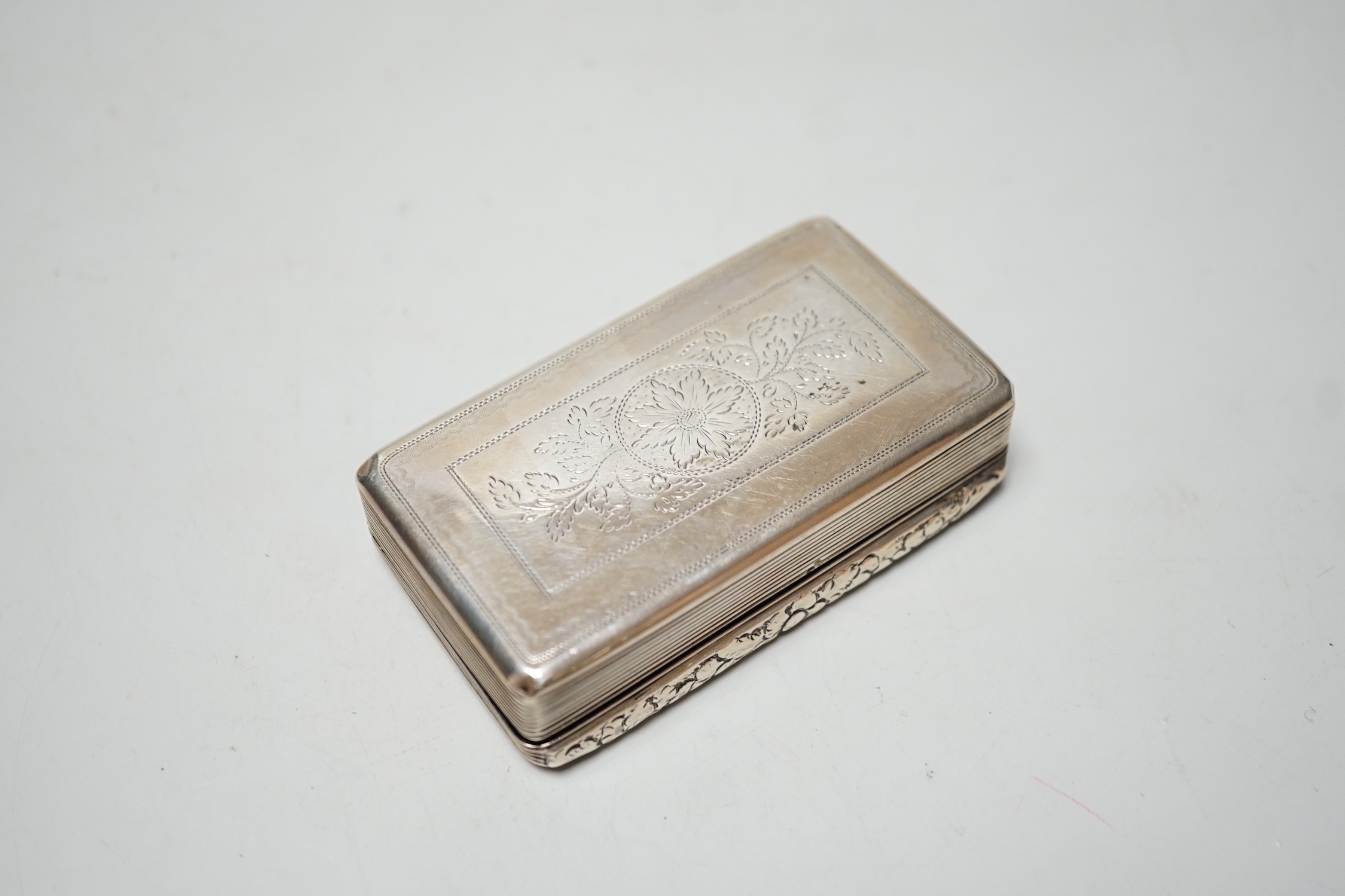 A late George IV engraved silver rectangular snuff box, with wriggle work decoration, William Simpson, Birmingham, 1829, 81mm.